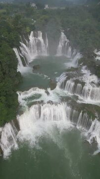 Drone Flying Backwards Revealing Detian Waterfalls in Cao Bang, Vietnam