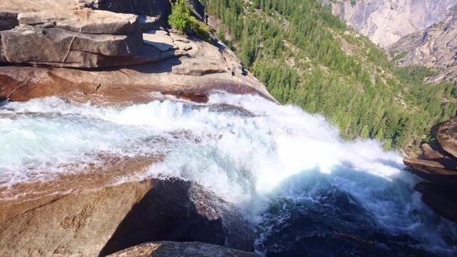 Scenic view from the top of Nevada Fall overlooks the Merced River along Yosemite's Mist Trail