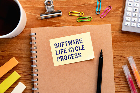SDLC and Software Life Cycle Process documentation on workspace &mdash; ideal eye-catcher for IT and development blogs