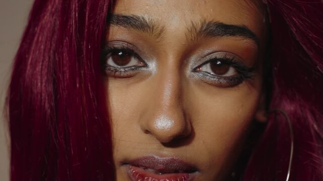 Woman with red hair posing in artistic portrait series