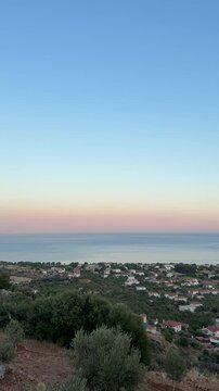 Palamutb&uuml;k&uuml; Dat&ccedil;a aerial view, dramatic cliffs, crystal-clear blue sea, almond trees, vast sky, stunning Mediterranean coastline
