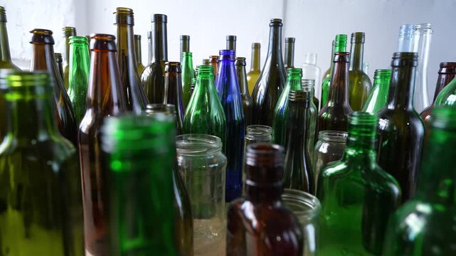 Empty Glass Bottles Symbolizing Alcohol Addiction, Alcoholism Problem and Social Consequences