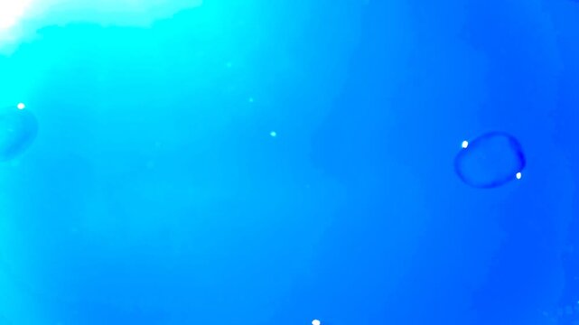 Soap Bubbles Flying through a Vivid Deep Blue Stylized Sky