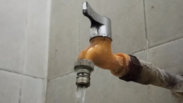 A water faucet equipped with a chrome lever handle for controlling water flow, showcasing a functional plumbing fixture commonly used in residential and commercial bathrooms or kitchens.