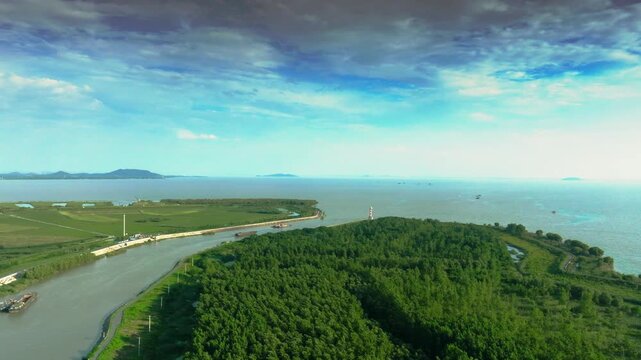Hefei Chaohu Binhu Pier Lighthouse Aerial: Red-and-White Tower Amid Greenery, Lake and Mountains in Distance