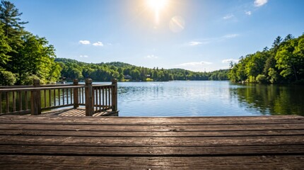 Naklejka premium A wooden dock reaches into a calm lake surrounded by forest.