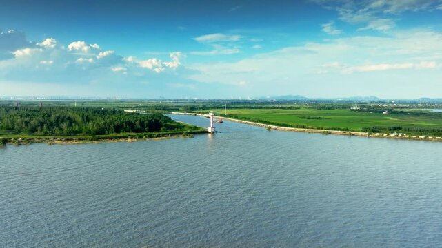 Hefei Chaohu Binhu Pier Lighthouse Aerial: Red-and-White Tower Amid Greenery, Lake and Mountains in Distance