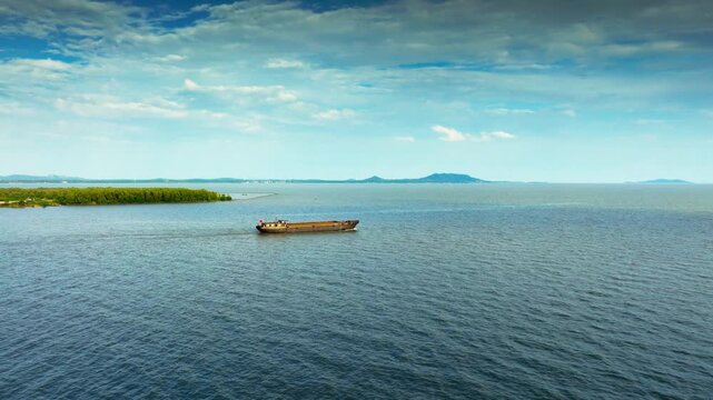 Hefei Chaohu Aerial: Cargo Boat Glides on Azure Waters, Distant Hills Mirror Blue Sky