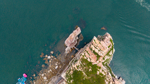 Aerial Top View of Coastal Rock Formations by Blue Sea