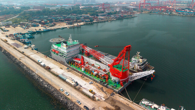 Large Crane Vessel Docked at Coastal Port Facility