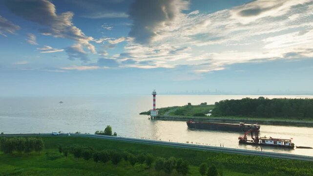 Hefei Chaohu Binhu Pier Lighthouse Aerial: Red-and-White Tower Amid Greenery, Lake and Mountains in Distance