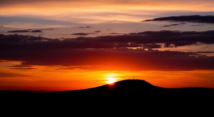 Fototapeta premium Sunset over mountain silhouette