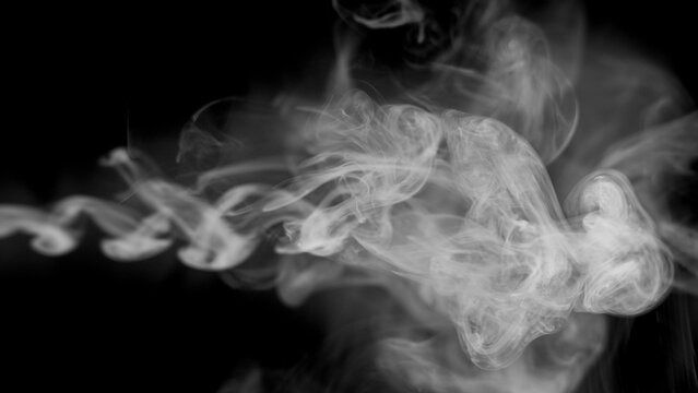 A dense formation of white smoke billows and cascades, revealing intricate layers and subtle shifts in opacity as it moves and morphs against a void of pure black.