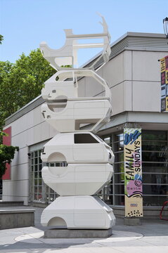 KELOWNA, BRITISH COLUMBIA, CANADA - 03 JULY 2026: Gold Silver and Lead public art sculpture by Jed Lind outside the Kelowna Art Gallery