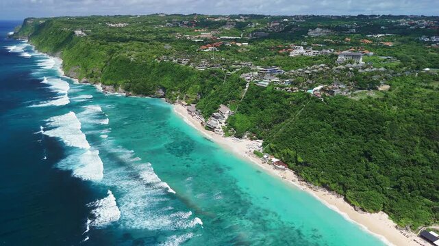 Tropical landscape with cliffs and luxury beach with ocean and waves. Drone view