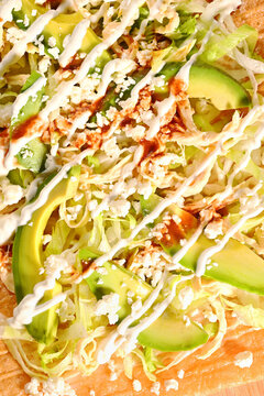 Fresh avocado chicharron preparado with Mexican ingredients. Direct flash light