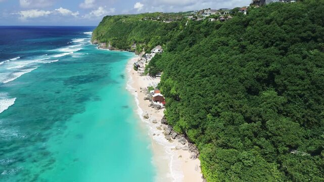 Tropical luxury beach with ocean and waves in Bali. Drone view
