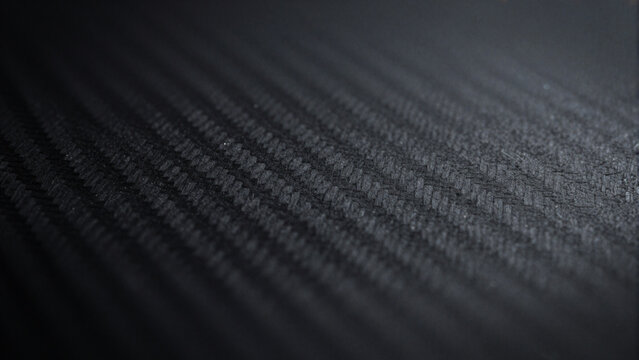 Dark textured carbon fiber pattern background