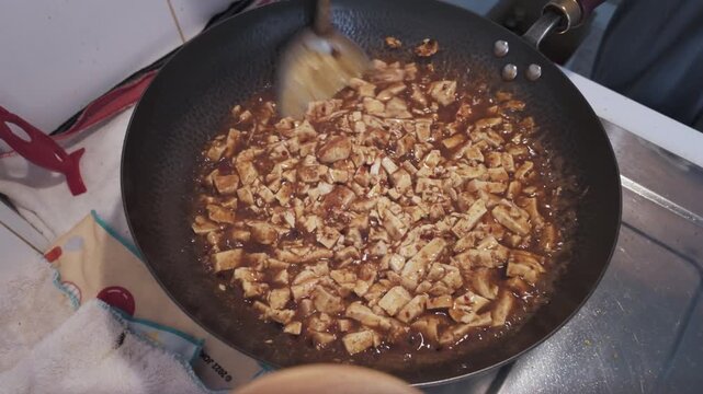 Vegetarian Mapo Tofu Stir Fry in Black Iron Wok with Sichuan Spices