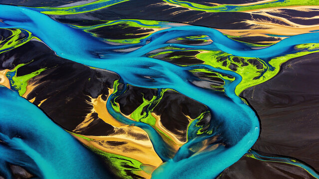 A breathtaking satellite view of an expansive river delta, where bright blue waters and green algae bloom mix against deep, dark earth and golden sandbars , full image sharp focused, 8k resolution