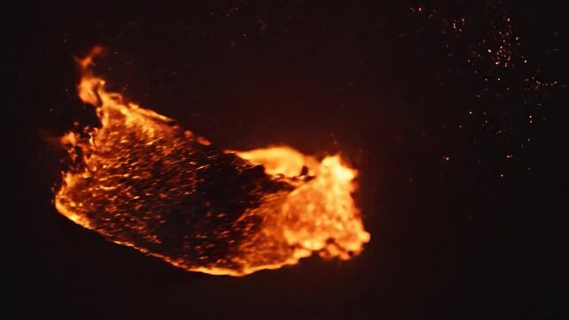 Dynamic fire explosion with glowing particles and abstract flame shapes on a dark background.