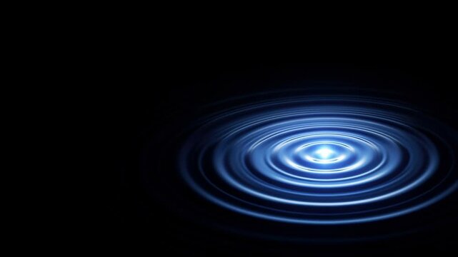 blue ripple effect on dark background creating a serene water surface
