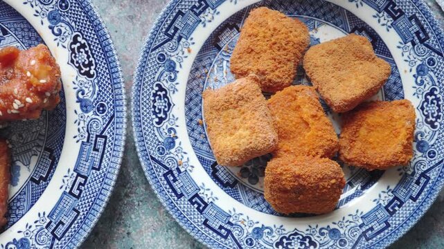 Fried snacks on a blue patterned plate