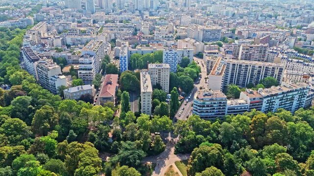 Paris is a dense capital defined by classic Haussmannian apartment blocks, zinc rooftops, tree-lined boulevards, and distinct residential neighborhoods. Notably many public parks as shown here.