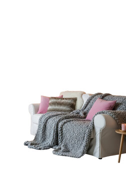 Sofa with pillows and blanket.