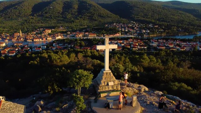 White cross on glavica hill overlooking stari grad, croatia
