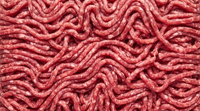 Close up raw ground beef texture pattern showing fresh red minced meat strands creating organic background for culinary preparation and protein food source content.