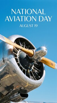 Close up of a vintage metal airplane propeller with National Aviation Day August 19 text on blue sky.
