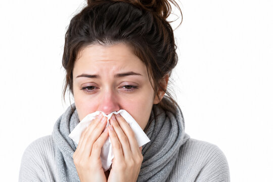 young woman sneezing