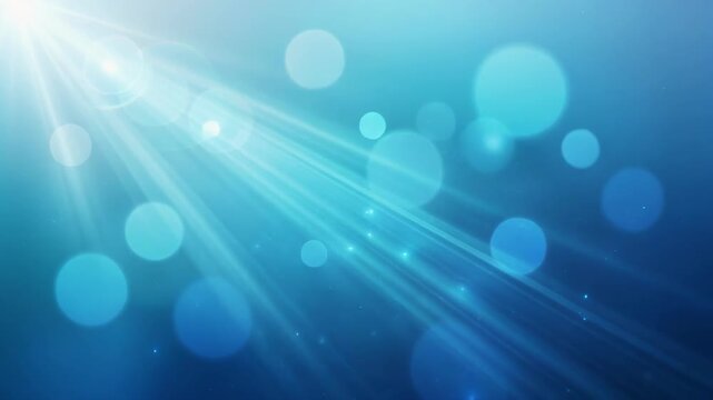 Bright blue abstract background with shining light rays and bokeh effects