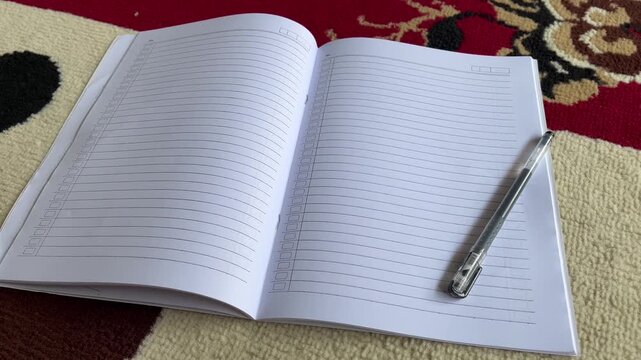 Open Lined Notebook with Pen on Table for Business Planning