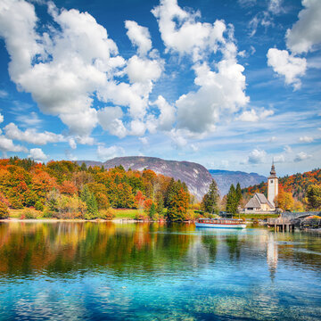 Remarkable view  of  Church of St. John the Baptist on Bohinj Lake .