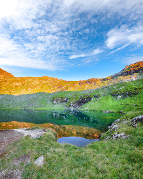 Amazing sunset view of Balea glacier lake near the Transfagarasan road.