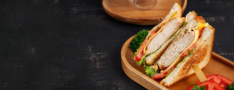 Rustic Breakfast Sandwich on Wooden Board with Copy Space
