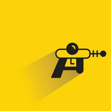 space gun icon with shadow on yellow background