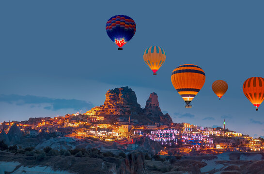 Hot air balloon flying over spectacular Cappadocia at sunset - Goreme, Turkey