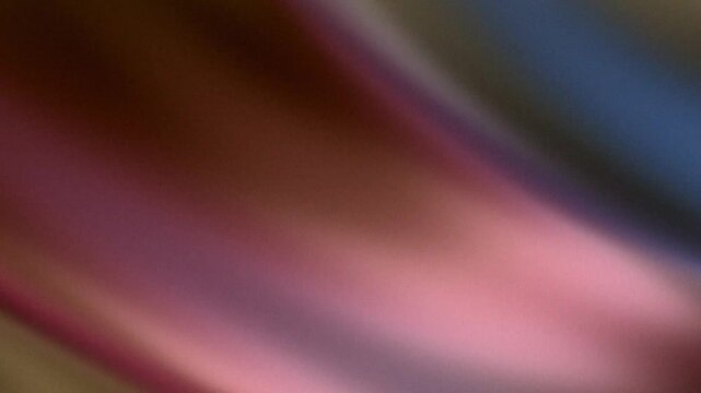 Soft diagonal color gradient background with a grainy retro texture