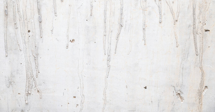 Distressed White Concrete Wall Texture with Mortar Drips.
