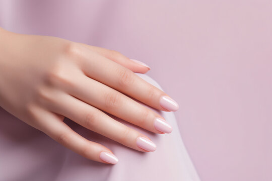 Glamour woman hand with light pink nail polish on her fingernails. Pink nail manicure with gel polish at luxury beauty salon. Nail art and design. Female hand model. French manicure. Generative AI.
