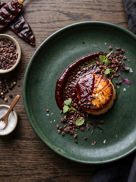 Seared Scallop with Dark Red Guajillo Chili Glaze and Cocoa Nibs