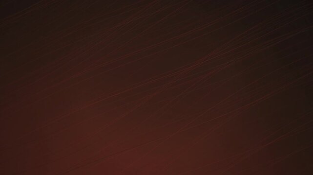 Faint linear patterns shift on a dark surface in a seamless loop