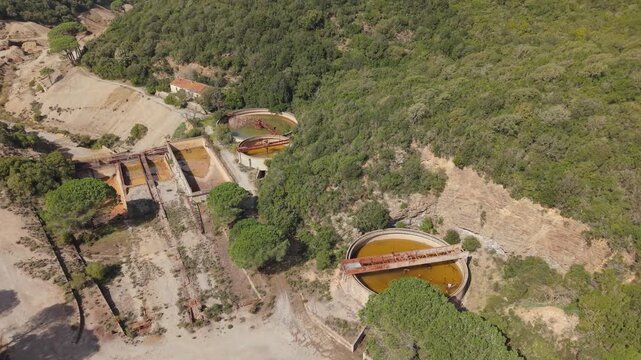 Settling Tanks Within Pozzo Sanna - Miniera Montevecchio In Sardinia, Italy. - aerial shot