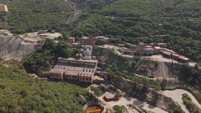Panoramic Aerial View Of Miniera di Montevecchio In Sardinia, Italy. Historic Mining Structures And Industrial Heritage Buildings.