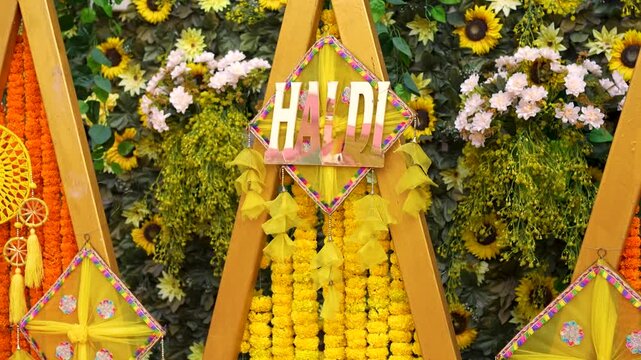 Haldi ceremony floral backdrop decoration. Traditional Indian wedding stage setup in Delhi NCR.