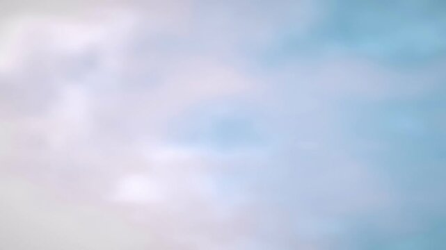 Soft pastel clouds drift gently in a seamless loop