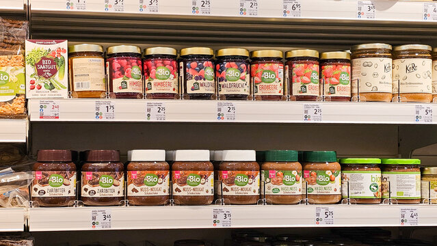 Organic jam and nut nougat jars on supermarket shelf